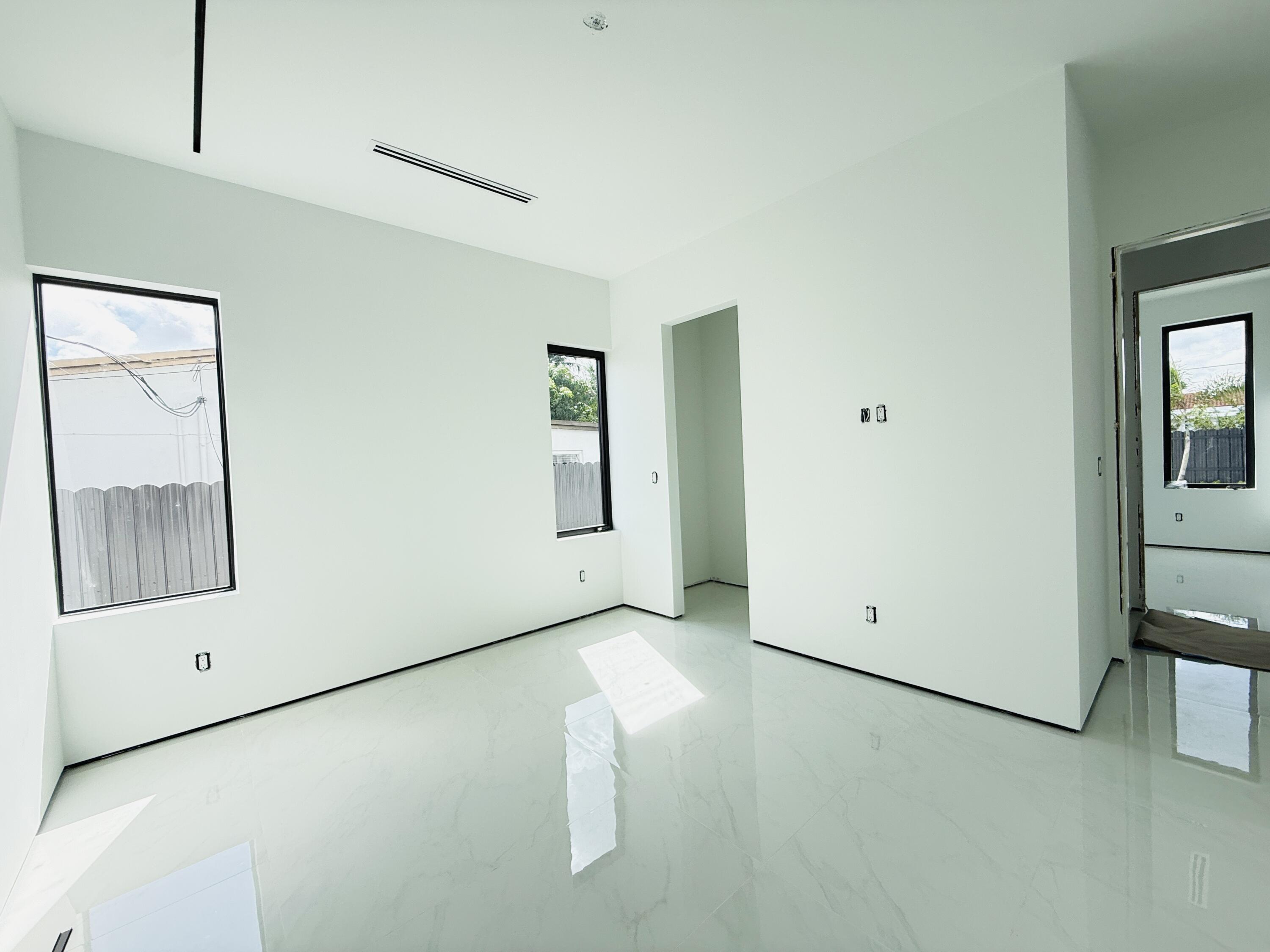 8966 Southwest 40th Terrace Miami, FL 33165 - Photo 27 of 40 a view of room with window and refrigerator