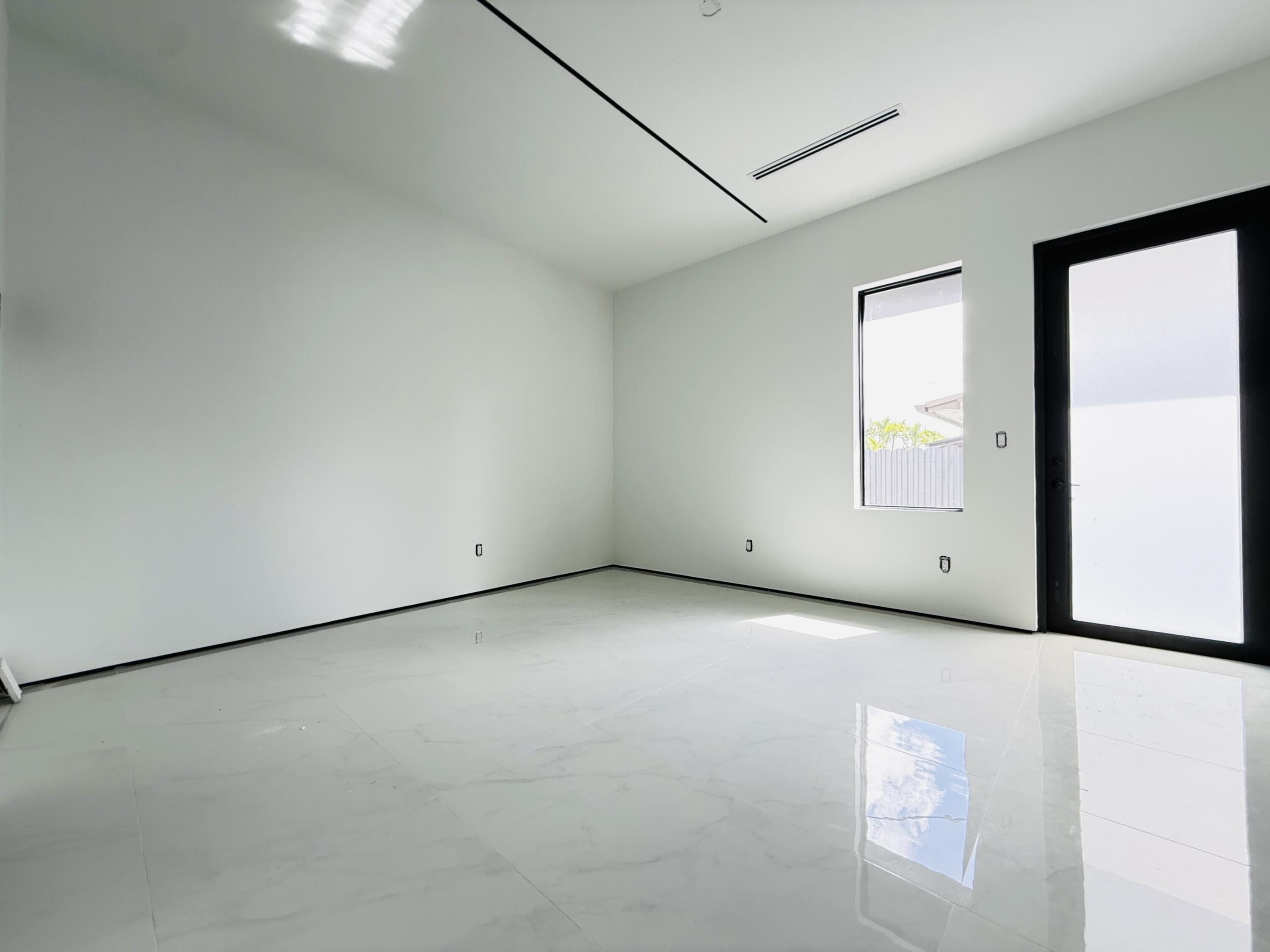 8966 Southwest 40th Terrace Miami, FL 33165 - Photo 30 of 40 an empty room with windows