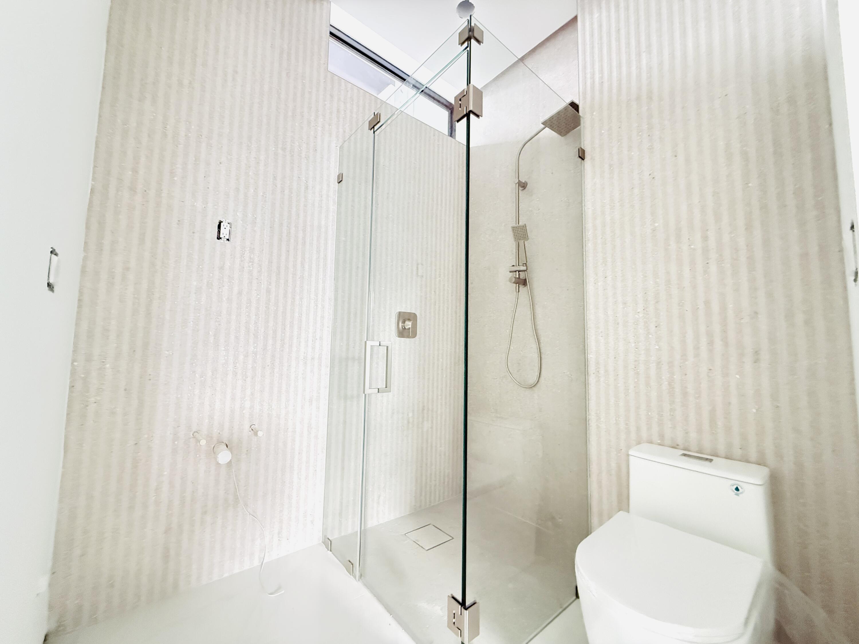8966 Southwest 40th Terrace Miami, FL 33165 - Photo 32 of 40 a bathroom with a shower a toilet and a sink