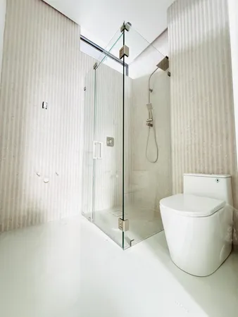 a bathroom with a shower and a tub