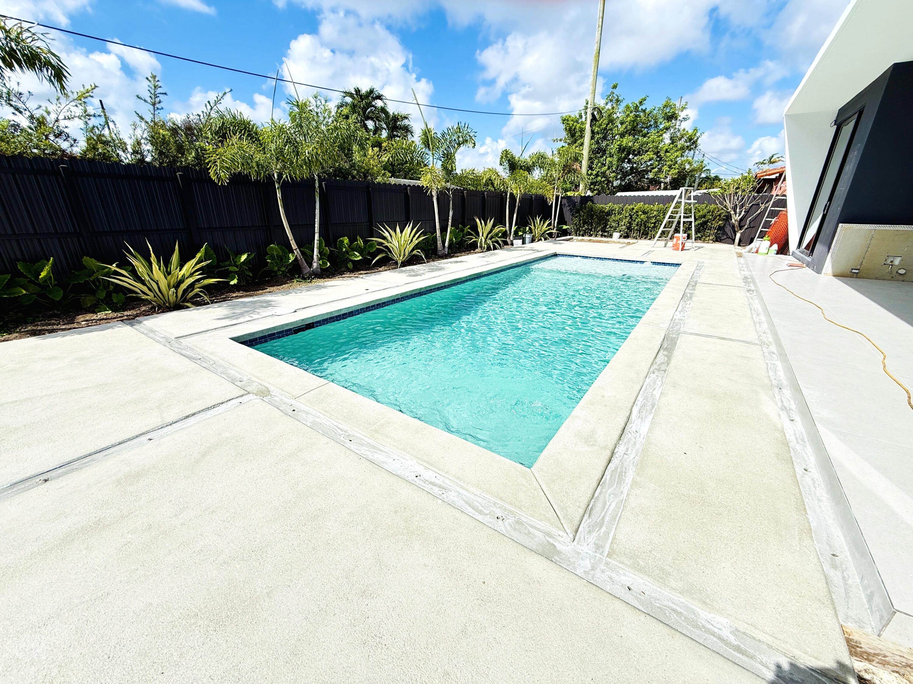 8966 Southwest 40th Terrace Miami, FL 33165 - Photo 34 of 40 a view of a backyard with plants