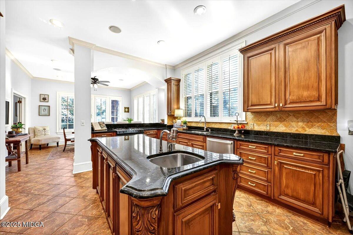 1158 Jackson Springs Road Macon, GA 31211 - Photo 12 of 42 a kitchen that has a sink and chairs