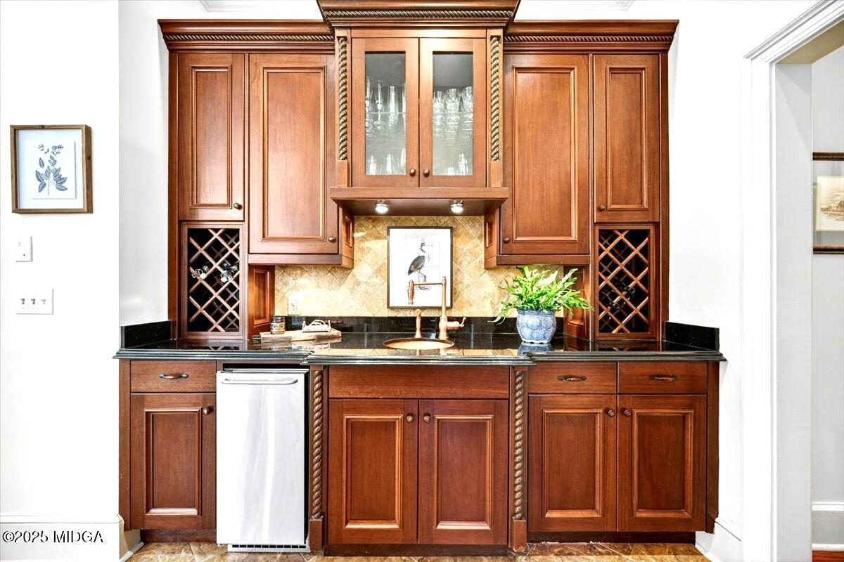 1158 Jackson Springs Road Macon, GA 31211 - Photo 15 of 42 a kitchen with granite countertop cabinets and black appliances
