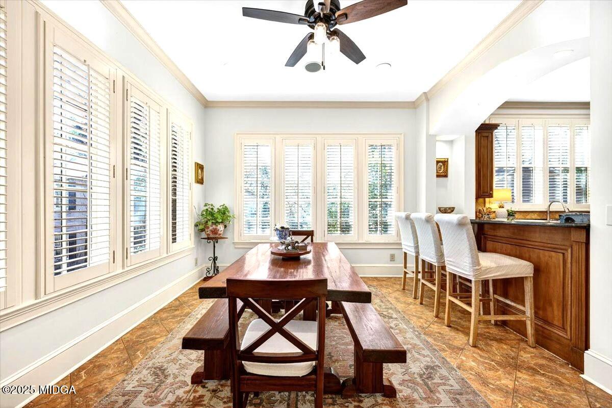 1158 Jackson Springs Road Macon, GA 31211 - Photo 16 of 42 a dining room with wooden floor and large windows