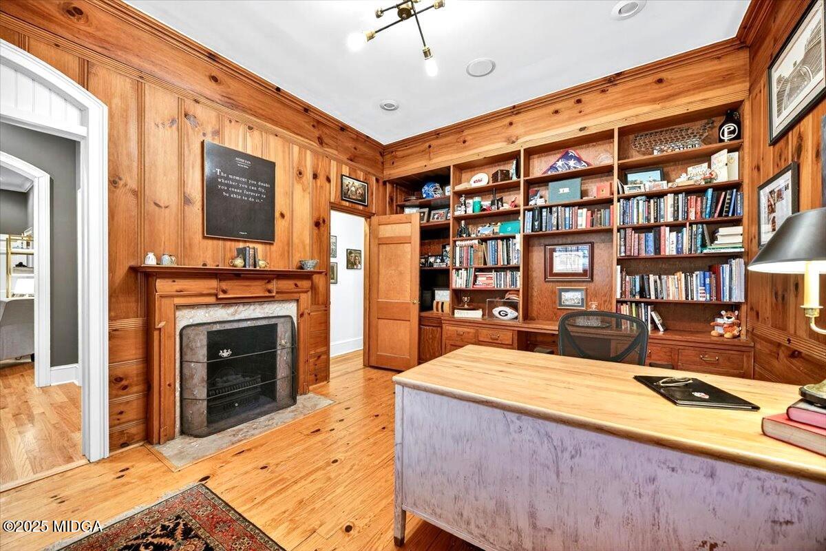 1158 Jackson Springs Road Macon, GA 31211 - Photo 19 of 42 a large bedroom with a bed and a fireplace