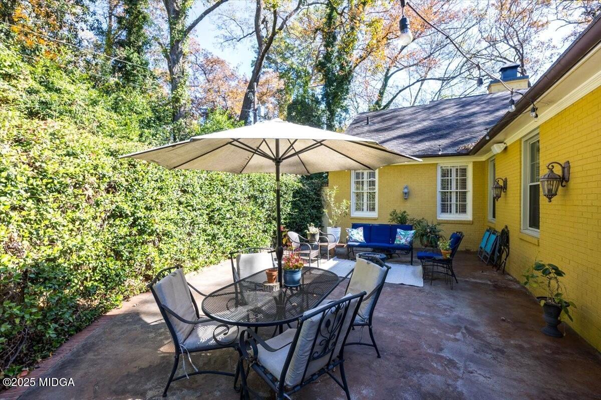 1158 Jackson Springs Road Macon, GA 31211 - Photo 26 of 42 a view of a patio with furniture and a backyard