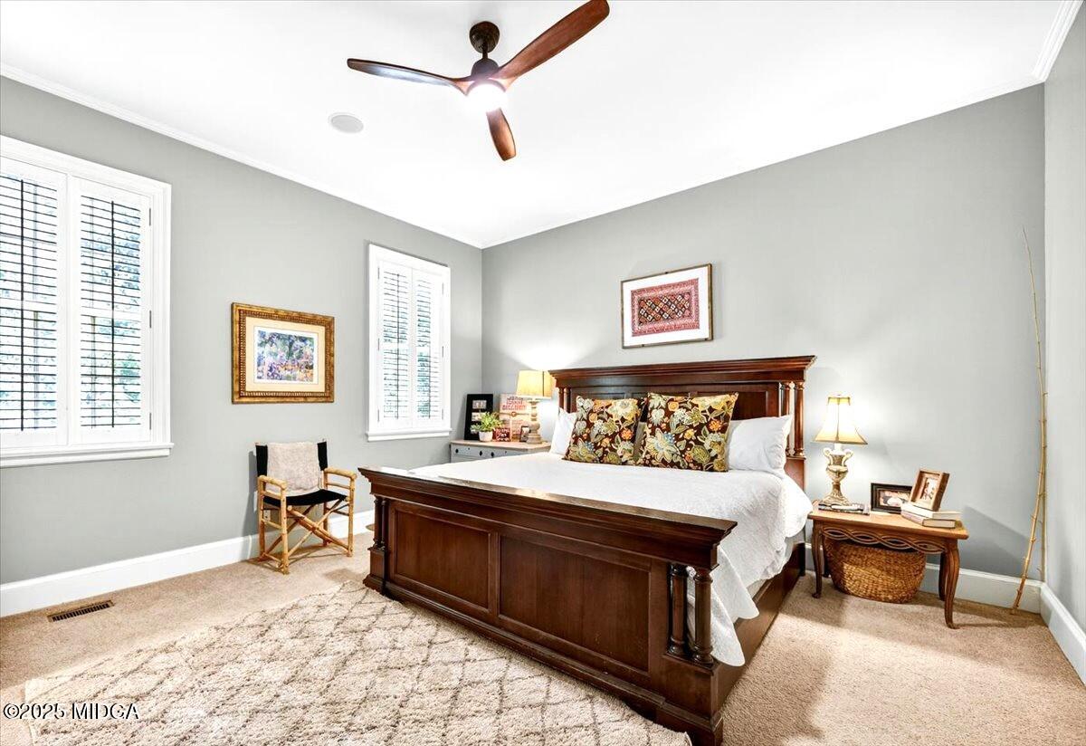 1158 Jackson Springs Road Macon, GA 31211 - Photo 27 of 42 a bedroom with a bed and a table