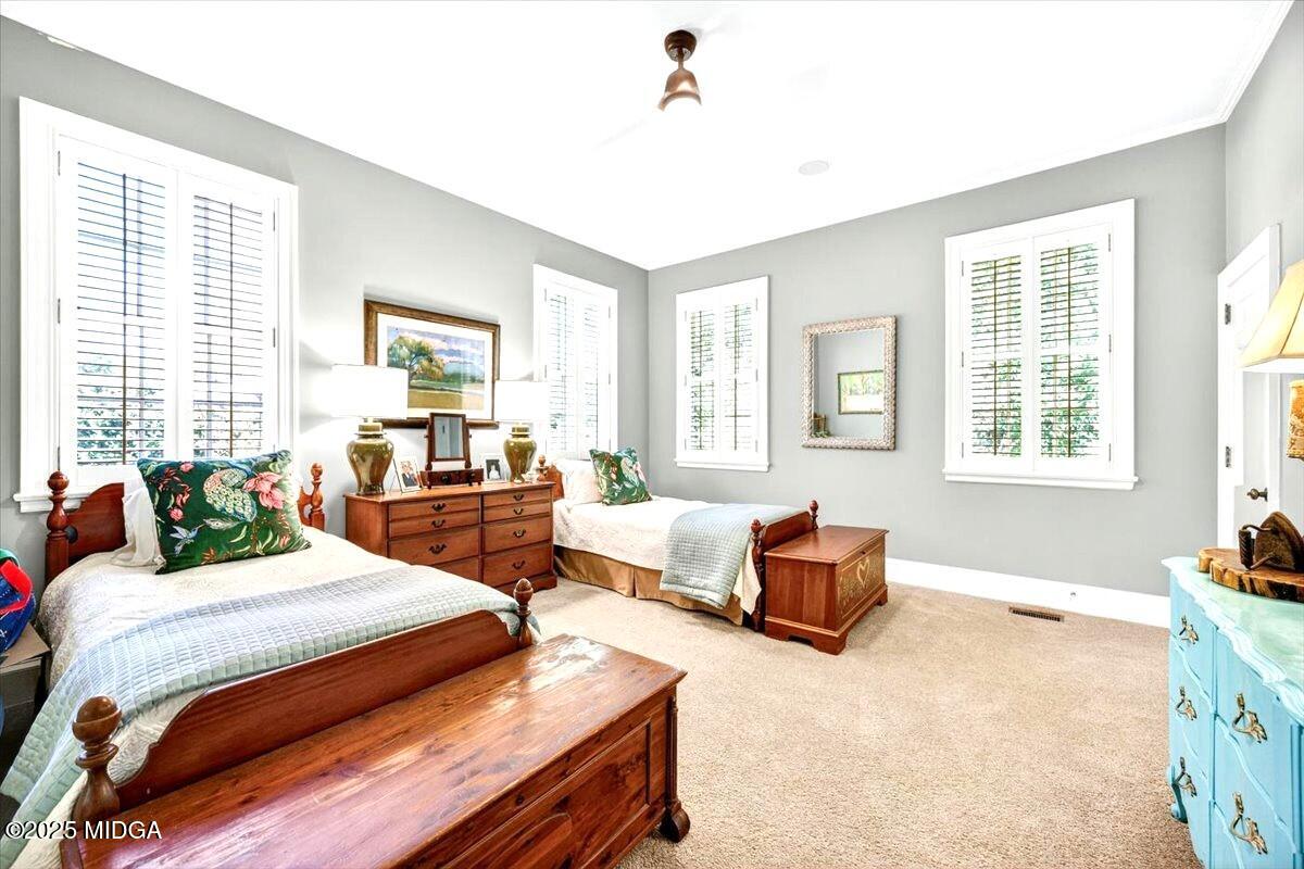 1158 Jackson Springs Road Macon, GA 31211 - Photo 29 of 42 a bedroom with bed couch and window