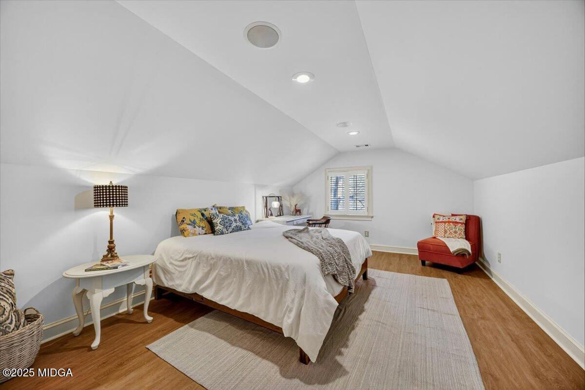 1158 Jackson Springs Road Macon, GA 31211 - Photo 34 of 42 a bedroom with a bed and lamp