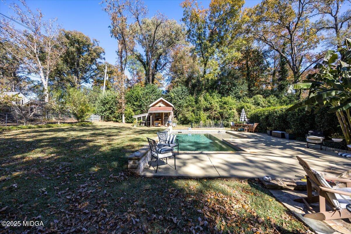1158 Jackson Springs Road Macon, GA 31211 - Photo 37 of 42 a view of a house with a yard