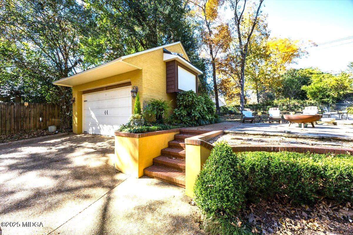 1158 Jackson Springs Road Macon, GA 31211 - Photo 39 of 42 a view of swimming pool with lawn chairs and plants