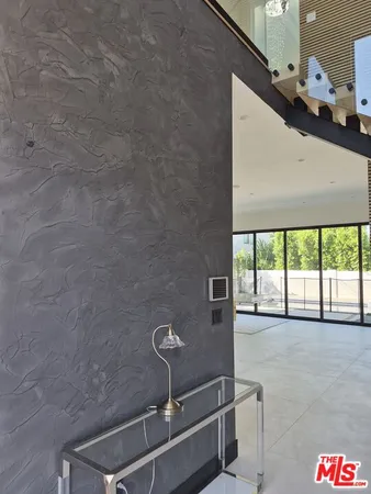 a room with water heater and a floor to ceiling window