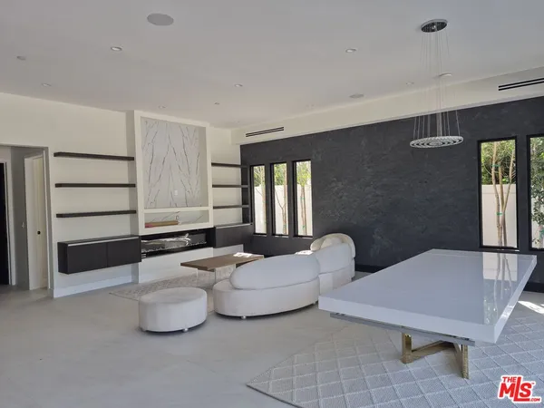 a living room with furniture and window