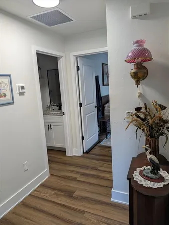 a bedroom with furniture and a flat screen tv