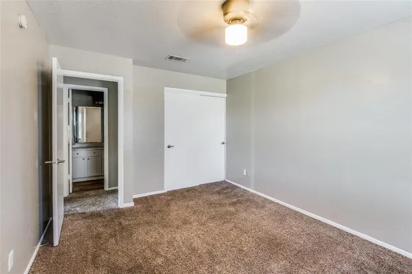 an empty room with a bathroom