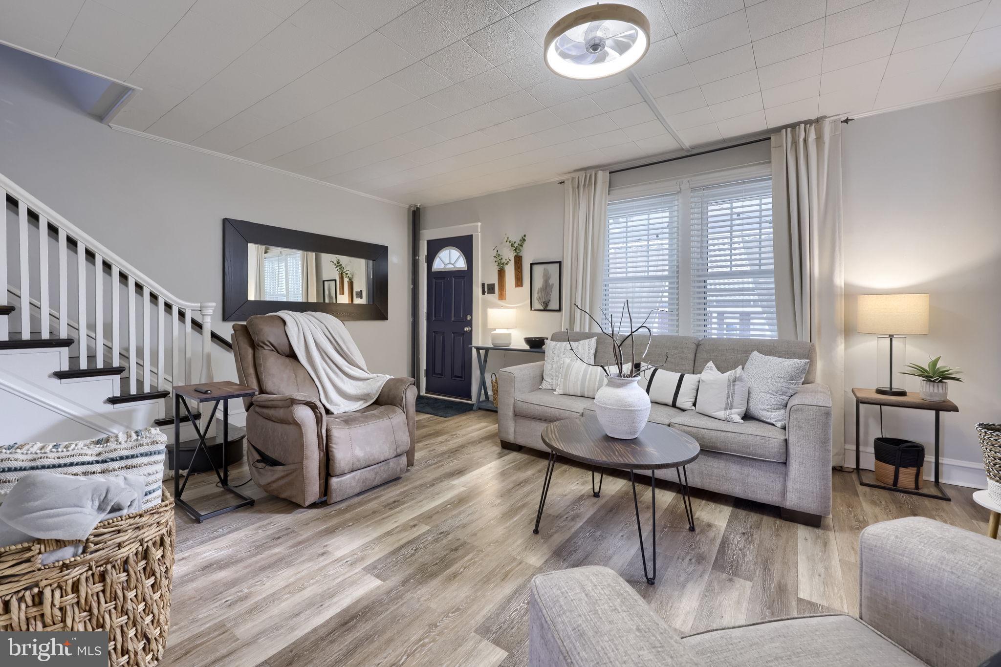 827 3rd Street Lancaster, PA 17603 - Photo 11 of 37 a living room with furniture and a wooden floor