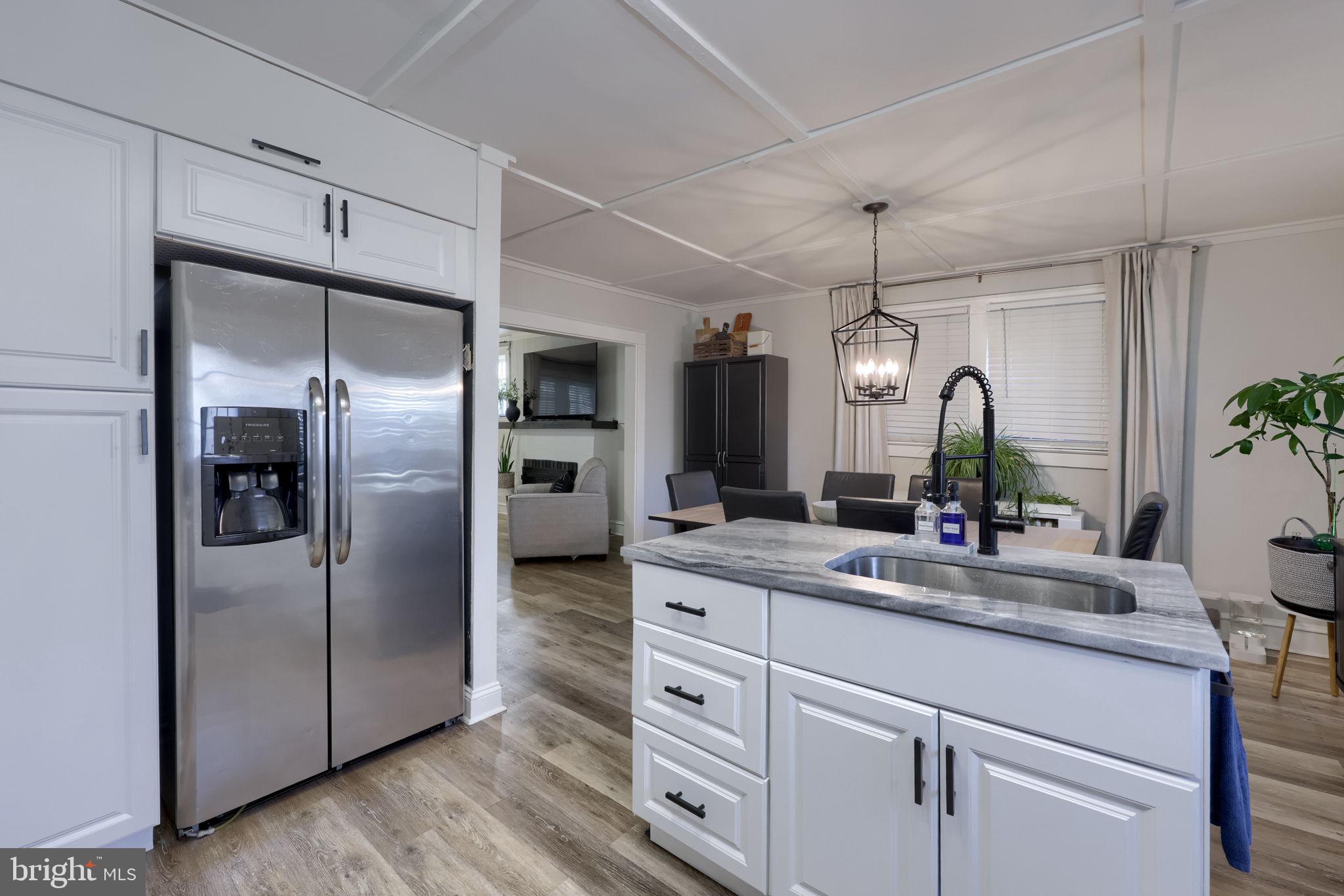 827 3rd Street Lancaster, PA 17603 - Photo 19 of 37 a large kitchen with a refrigerator and a sink