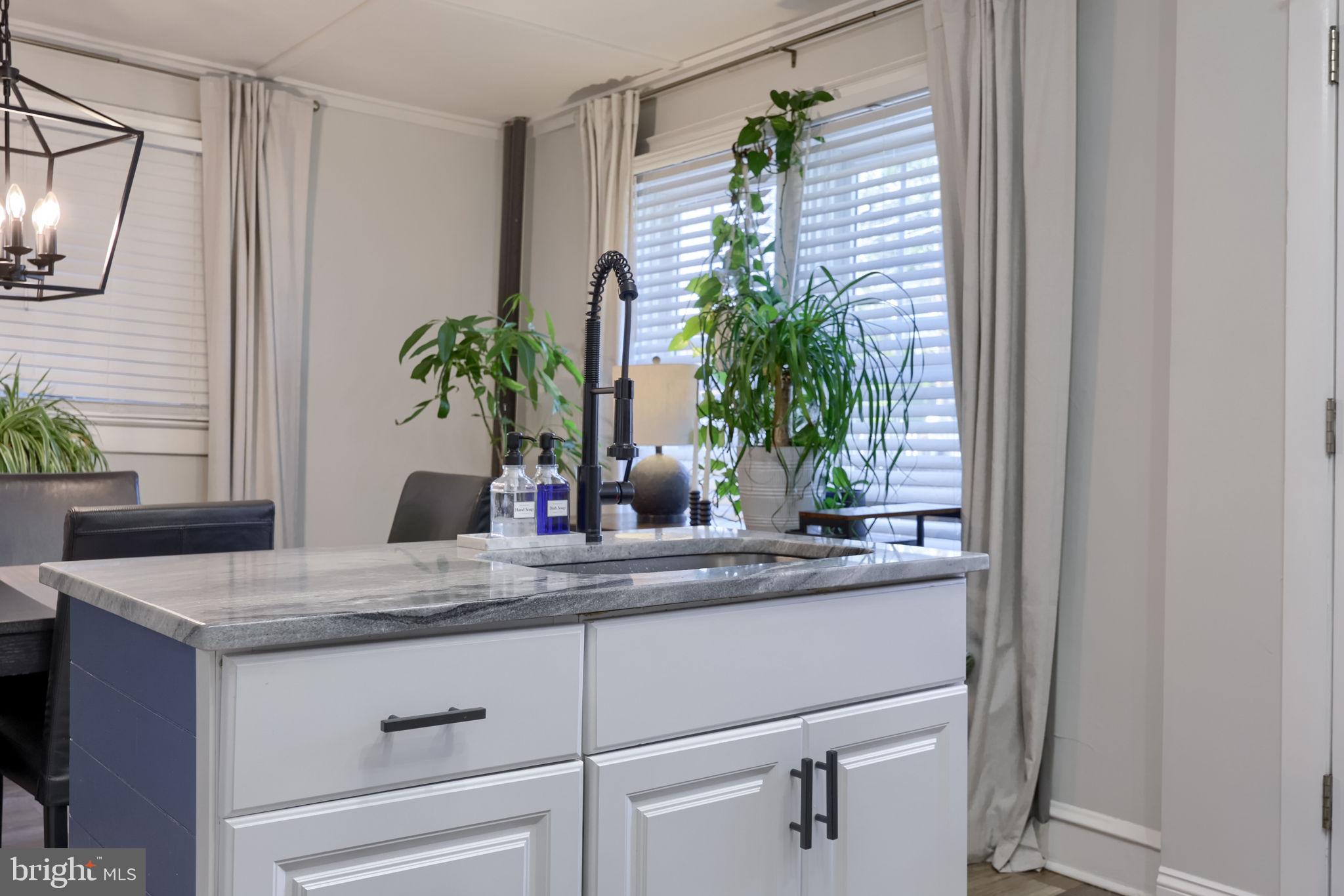 827 3rd Street Lancaster, PA 17603 - Photo 21 of 37 a kitchen with a sink and a mirror