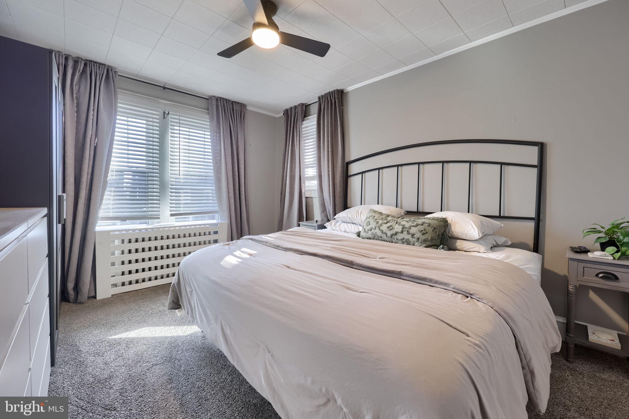 827 3rd Street Lancaster, PA 17603 - Photo 26 of 37 a large bed sitting in a bedroom next to a window