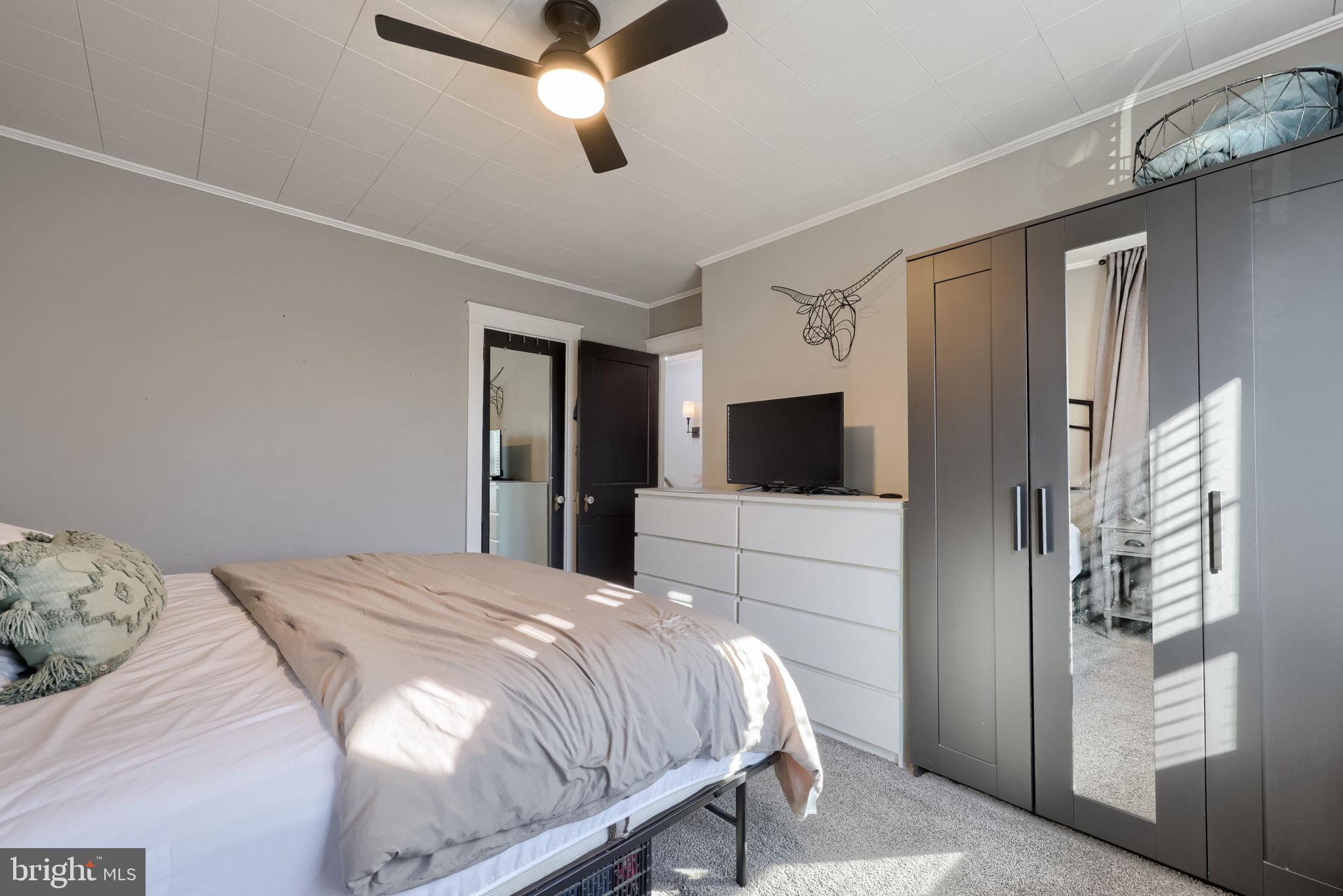 827 3rd Street Lancaster, PA 17603 - Photo 27 of 37 a bedroom with a large bed and a flat screen tv