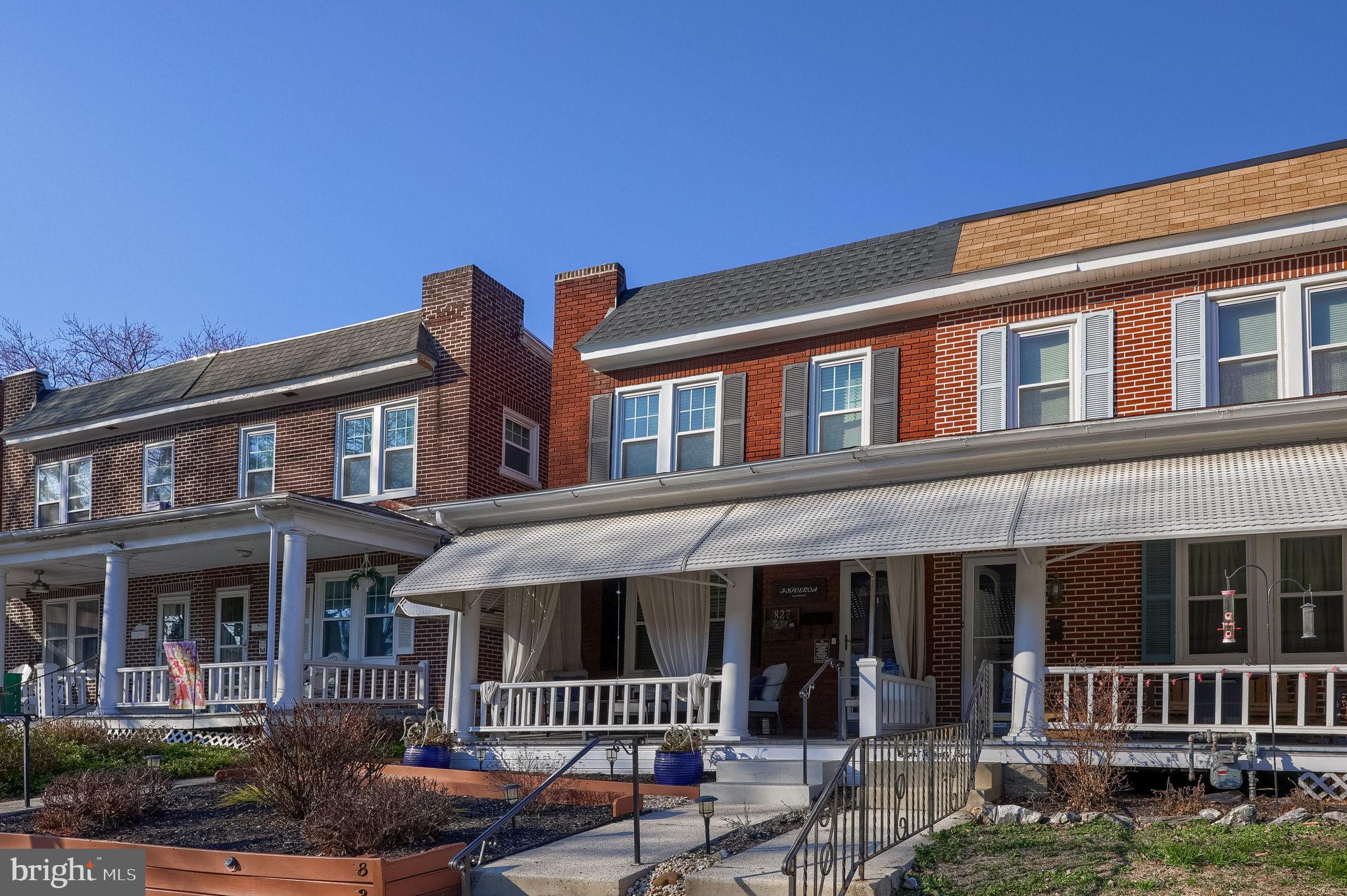 827 3rd Street Lancaster, PA 17603 - Photo 3 of 37 a front view of a residential apartment building with a yard