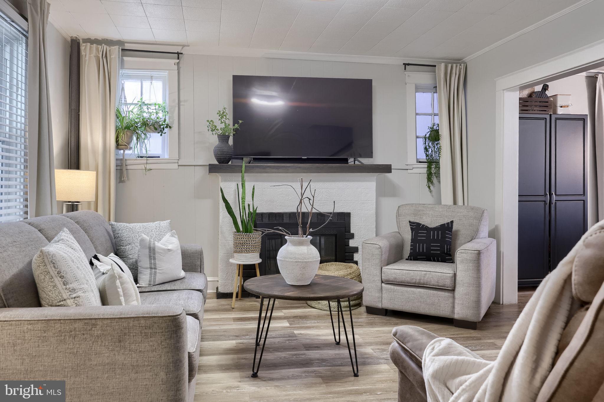 827 3rd Street Lancaster, PA 17603 - Photo 9 of 37 a living room with furniture and a flat screen tv