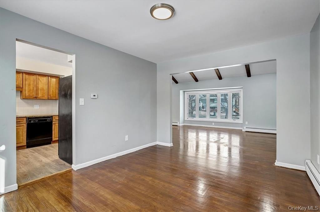 36 Ironworks Road Monroe, NY 10950 - Photo 14 of 37 Spare room featuring beamed ceiling, dark wood finished floors, and a baseboard radiator