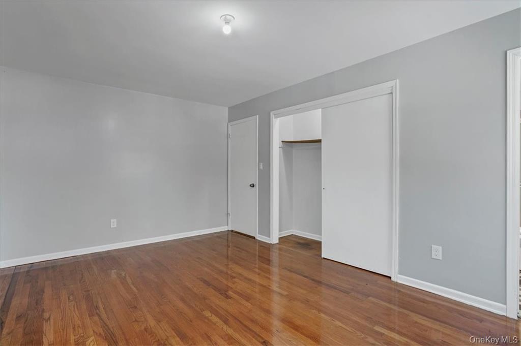 36 Ironworks Road Monroe, NY 10950 - Photo 23 of 37 Unfurnished bedroom with dark wood-type flooring and a closet