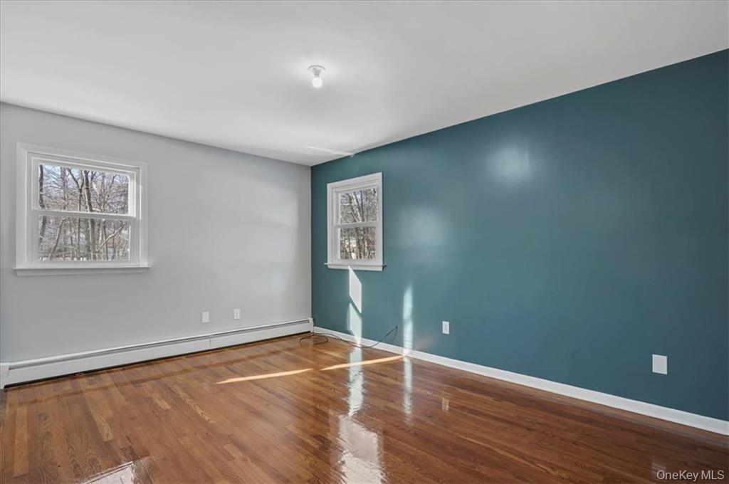 36 Ironworks Road Monroe, NY 10950 - Photo 24 of 37 Spare room with wood finished floors and baseboard heating
