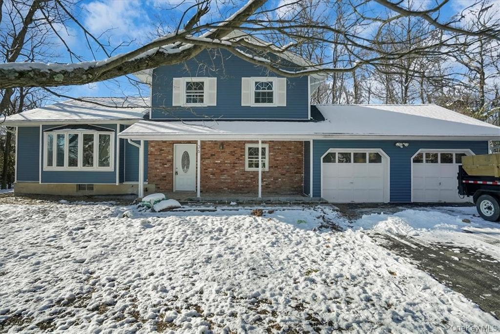 36 Ironworks Road Monroe, NY 10950 - Photo 3 of 37 View of front facade with an attached garage and brick siding