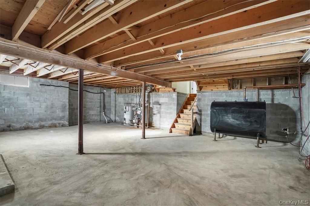 36 Ironworks Road Monroe, NY 10950 - Photo 32 of 37 Unfinished below grade area featuring stairs, heating fuel, and water heater