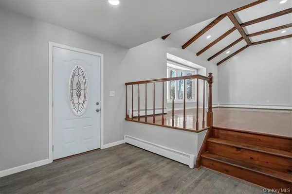 a view of entryway with wooden floor