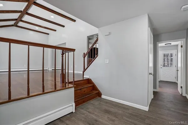 a view of entryway with wooden floor