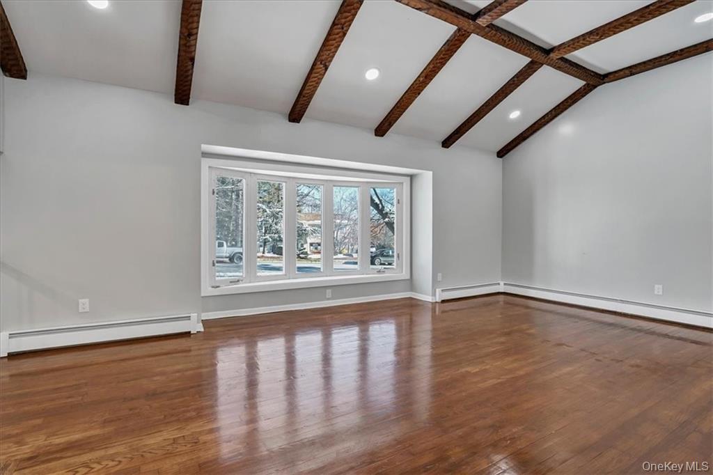 36 Ironworks Road Monroe, NY 10950 - Photo 9 of 37 Unfurnished living room featuring dark wood-type flooring, recessed lighting, and a baseboard radiator