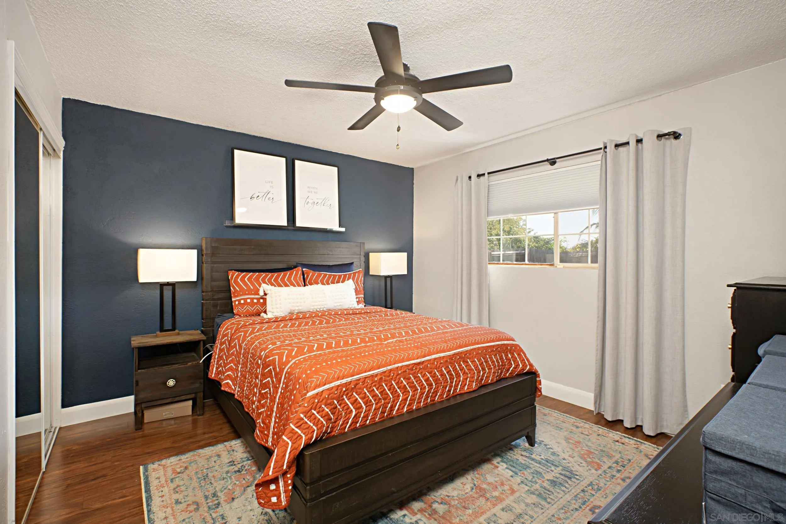 8823 Kelburn Avenue Spring Valley, CA 91977 - Photo 19 of 34 a bedroom with a bed and window