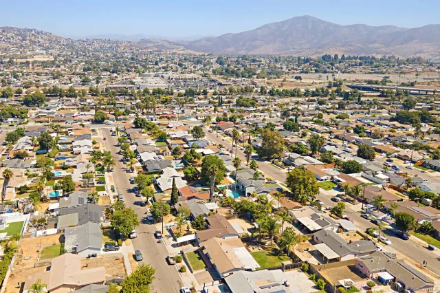 an aerial view of residential houses with outdoor space