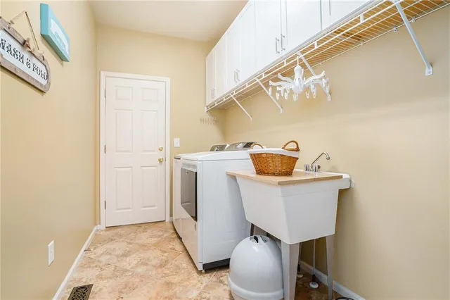 a utility room with dryer and washer