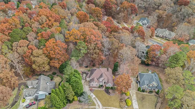 an aerial view of residential houses with outdoor space