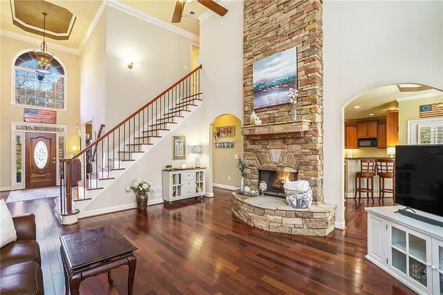 a living room with fireplace furniture and a flat screen tv
