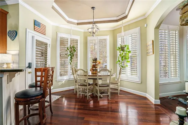 a dining room with furniture window wooden floor
