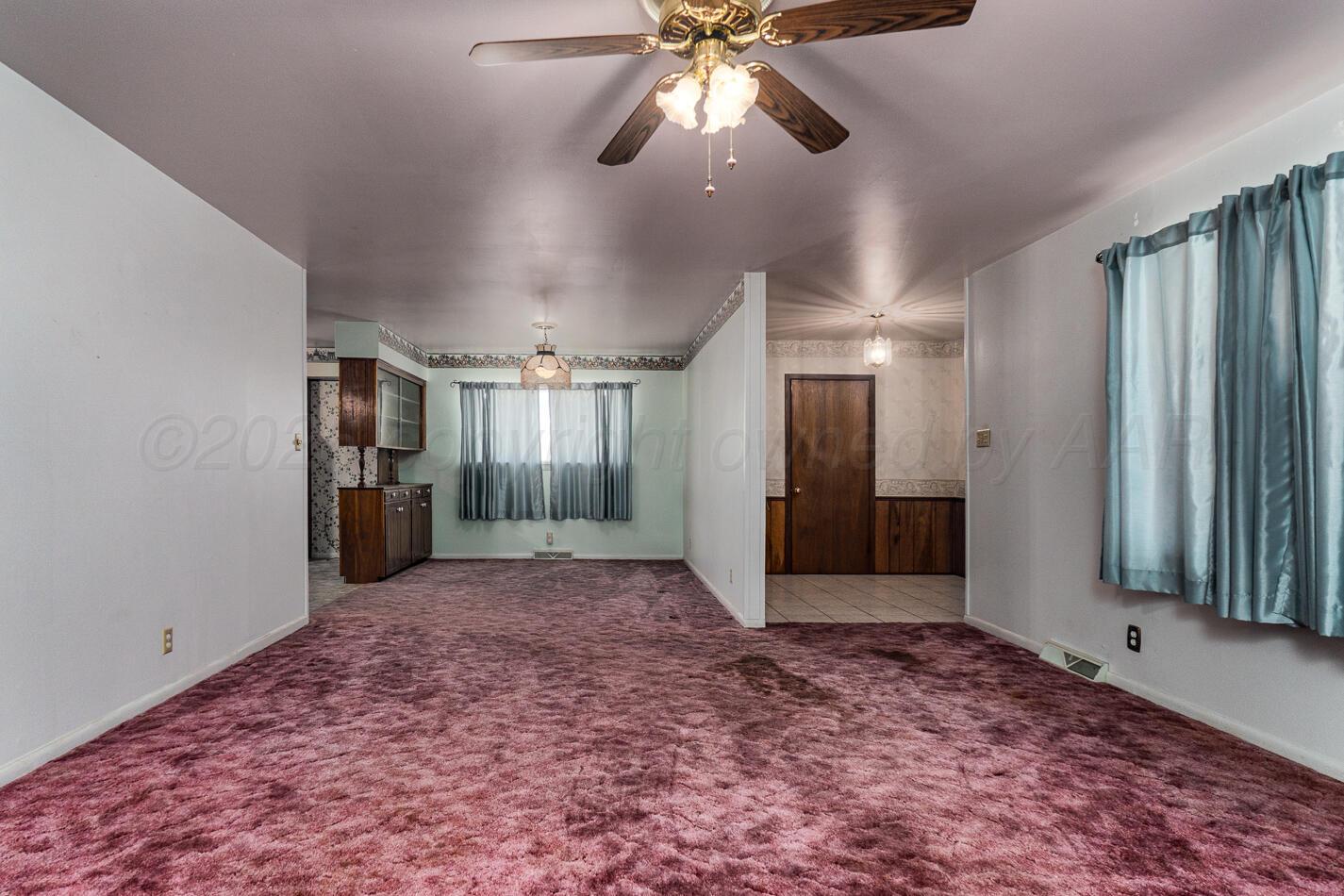 300 Mccarthy Street Borger, TX 79007 - Photo 11 of 31 a view of a hallway with a chandelier