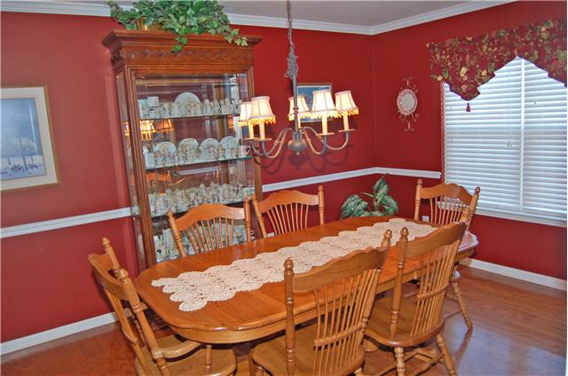 1510 Winter Court Spring Hill, TN 37174 - Photo 4 of 19 Another view of the formal dining room notice the crown molding and chair rail.