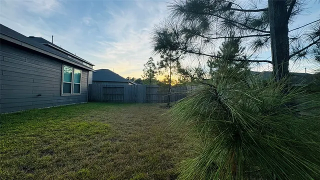 a backyard of a house with lots of green space