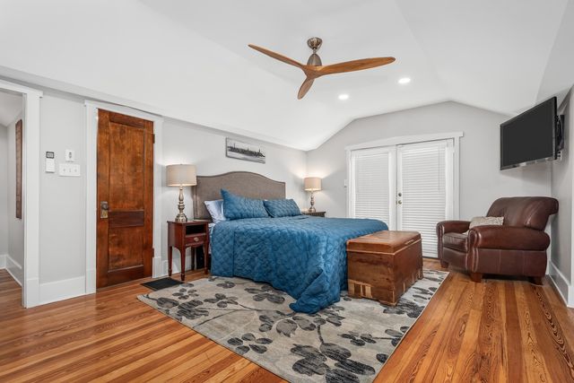 a bedroom with a bed and a couch