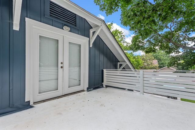 a view of a house with pool and chairs
