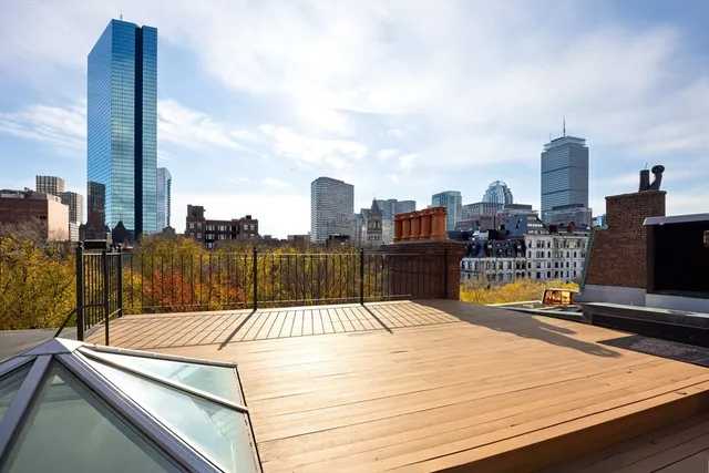 a view of a terrace with wooden floor