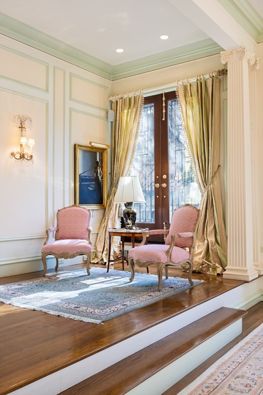 129 Commonwealth Avenue, Unit SF Boston, MA 02116 - Photo 4 of 19 a living room with furniture and large windows