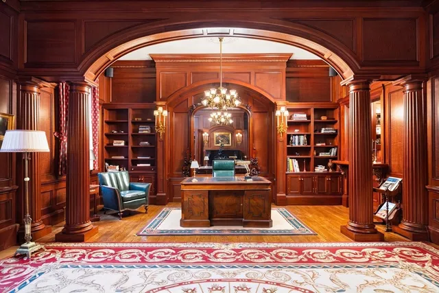a view of lobby with a fireplace and rug