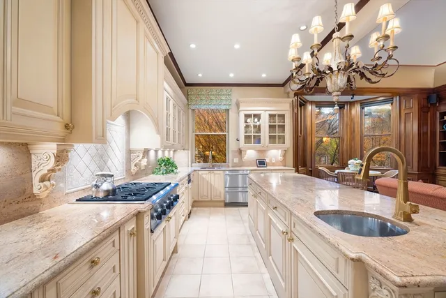 a kitchen with a sink stove and cabinets
