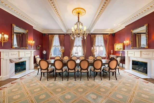 a view of a dining room with furniture and chandelier